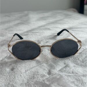 Gold and Black Oval Sunglasses